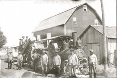 Farmers Pose Next To Their Steam Tractor
