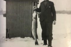 Cadillac-Hunting-And-Fishing-Man-Holding-Fish