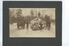 Cadillac-Lumber-Decking-Logs-Onto-A-Railroad-Car