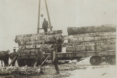 Cadillac-Lumber-Loading-Logs-Onto-Cars-For-Transport