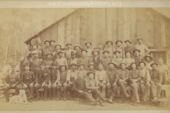 Cadillac-Lumber-Lumberjacks-Posing-In-Front-Of-Camp-Building-2