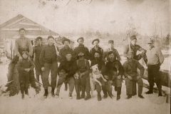 Cadillac-Lumber-Men-and-dogs-in-camp-near-Buckley
