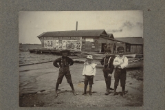 Children In Front Of A Boat Rental Building