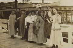Cadillac-People-Paulson-Ida-Maud-Latimer-Jewel-Geibhart-Myrtle-Shetson-Mrs.-Gieb-Gertrude-Shetson-Nellie-Peterson-Bessie-Haimer-Hazel-Nelson-in-front-of-boat-June-4-1910
