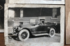 Car Beside The Big Red Shed Building