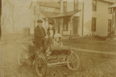 Family In An Early Car